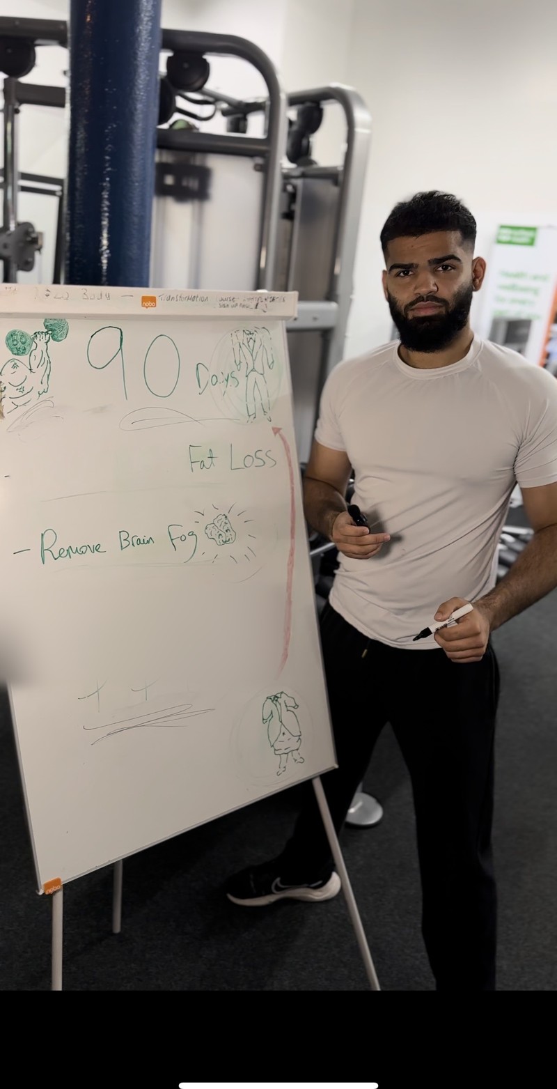 Hasnain mapping a 90-day plan on a whiteboard